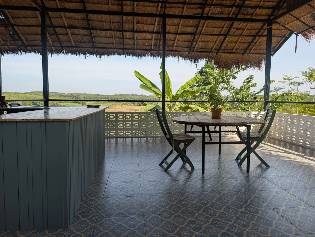The open-air teahouse with tables looking out over the orchard.